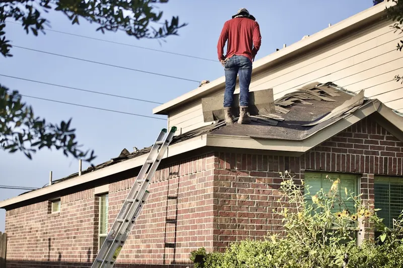Professional roofer working on a residential roof in Laguna Creek West